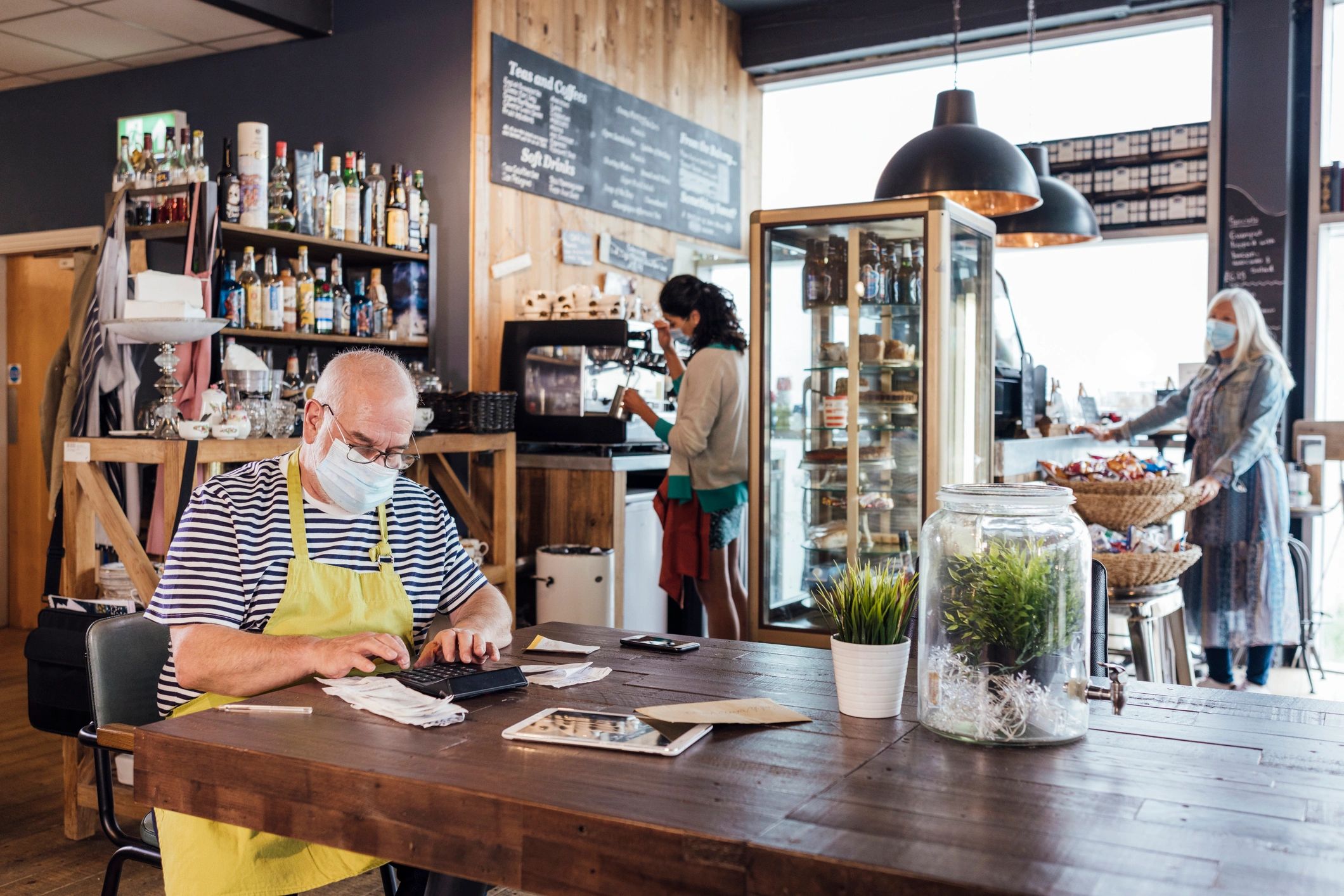 Small business owner reviewing receipts and bookkeeping