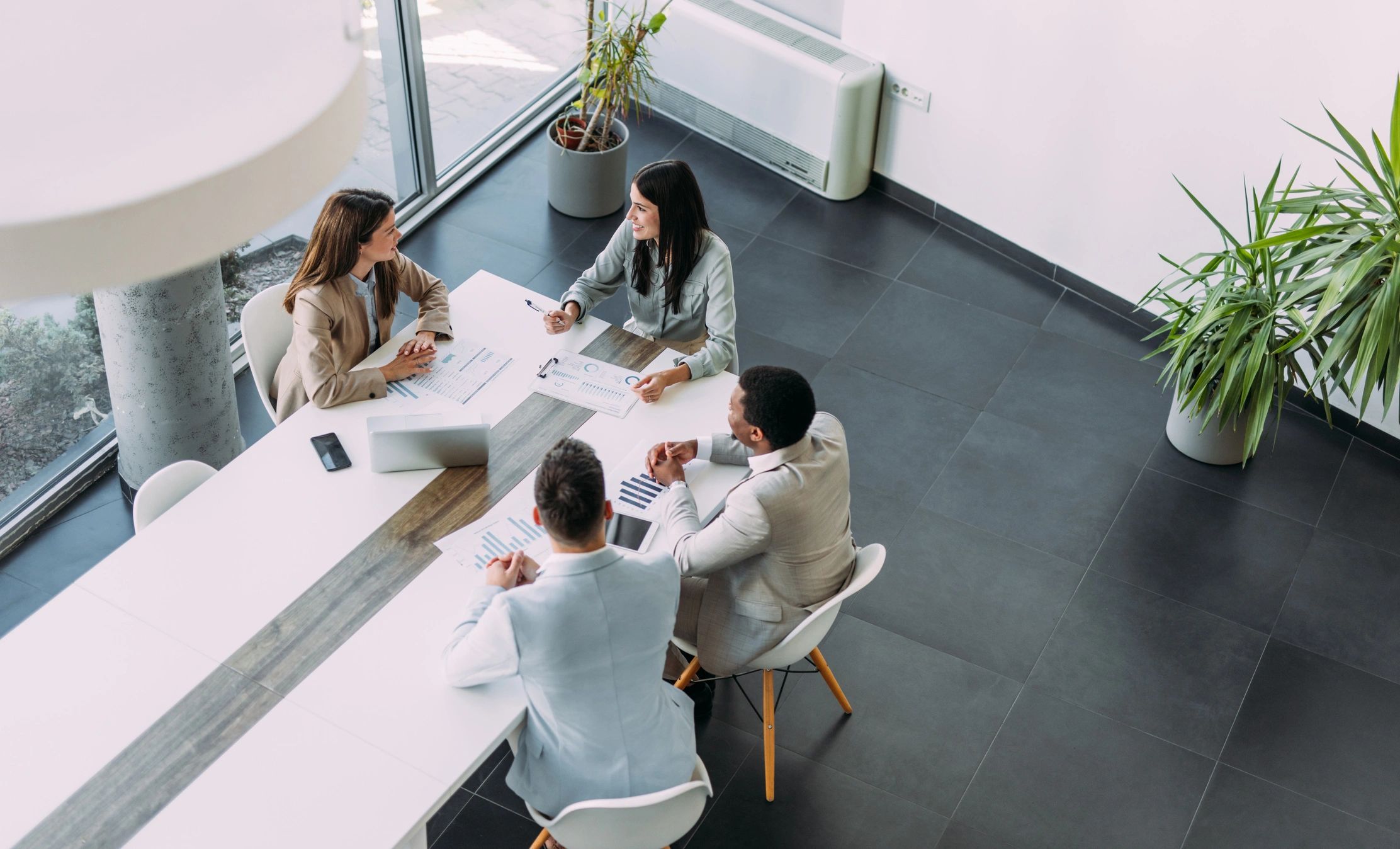 Business professionals meeting around a table in an office