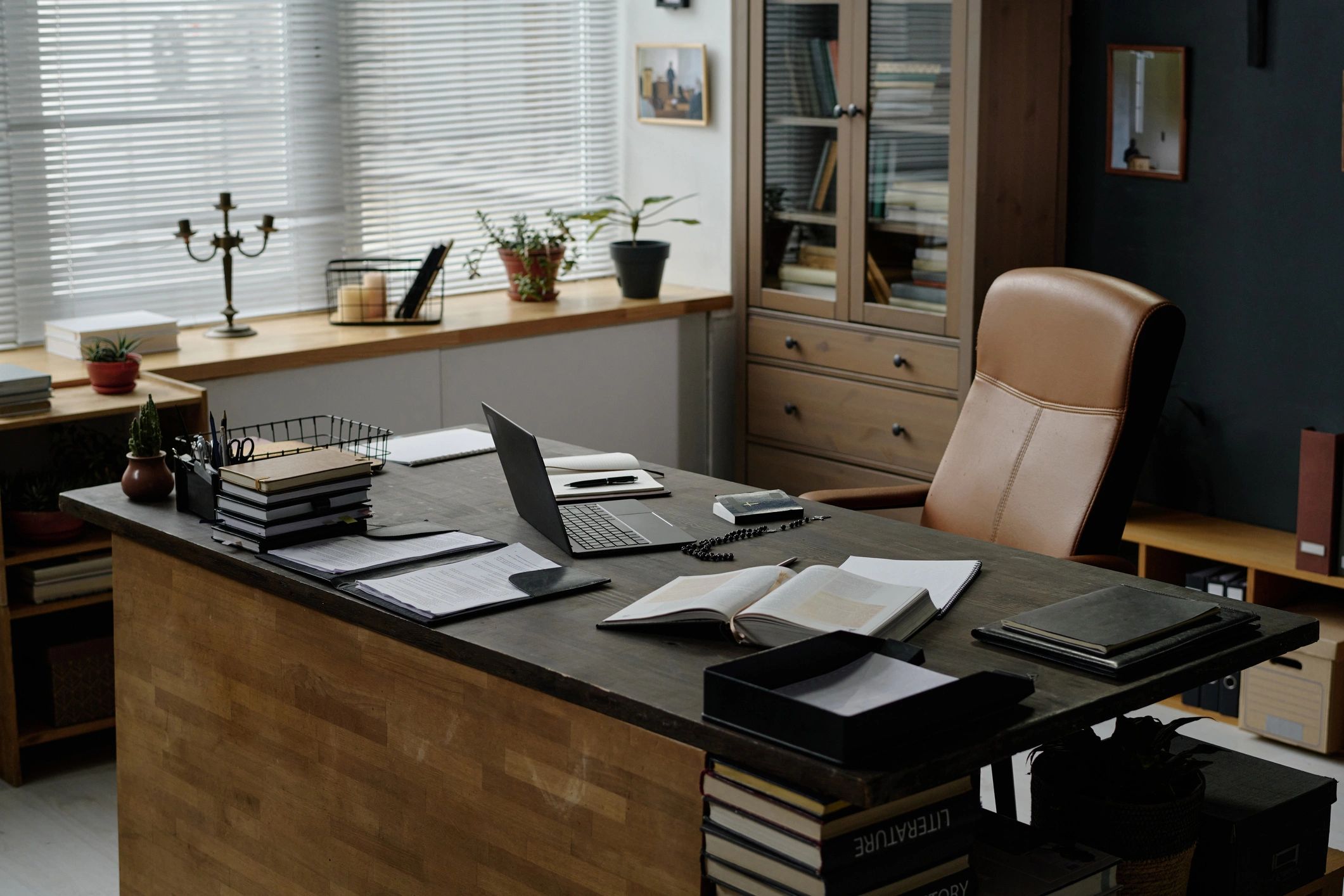 Professional bookkeeping office workspace with laptop and desk materials
