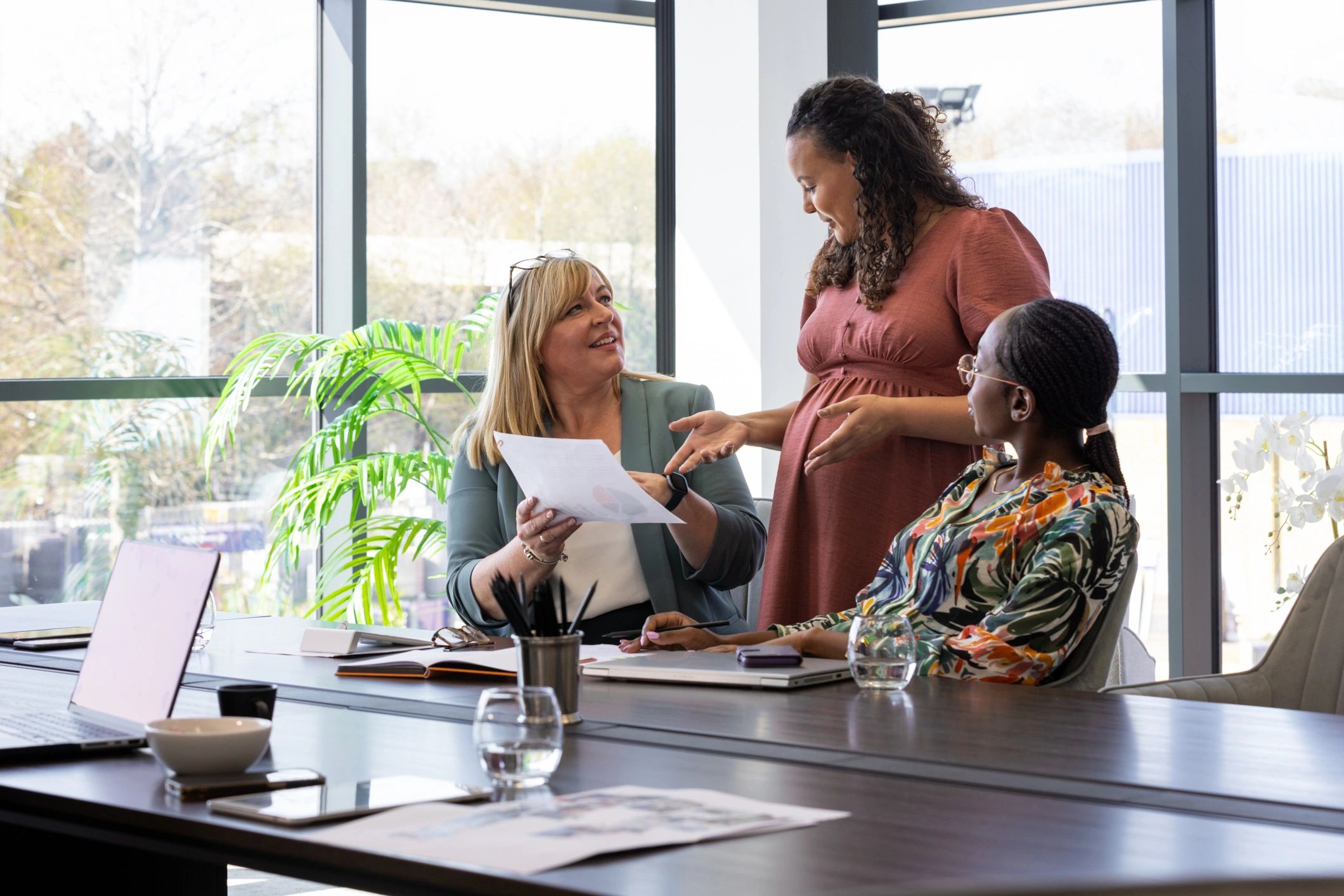 Tax professionals meeting with clients in a bright office